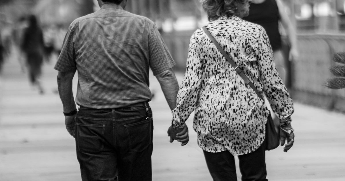 An older couple walking together
