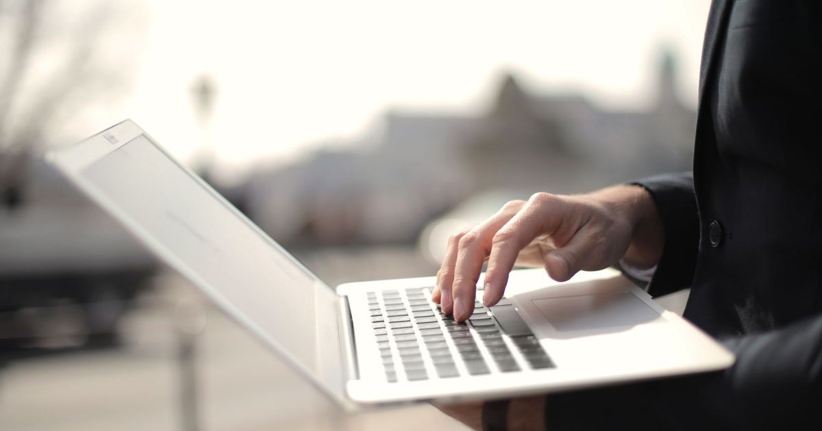 Working on a side hustle at a laptop